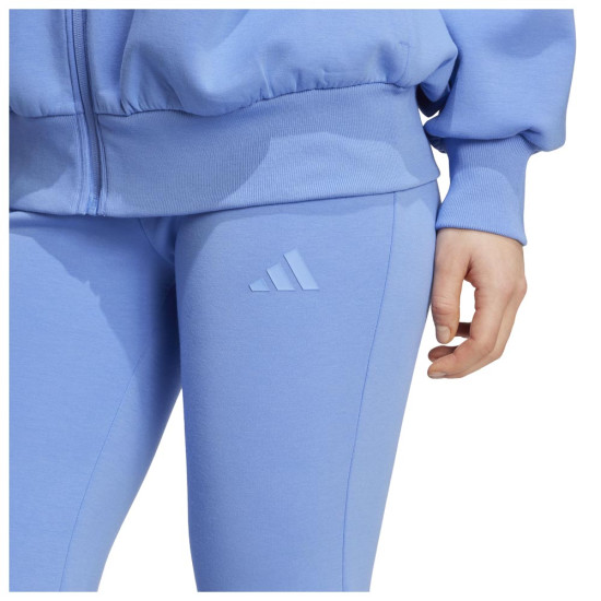 Adidas Γυναικείο παντελόνι φόρμας All SZN Soft Lux Flared Pants